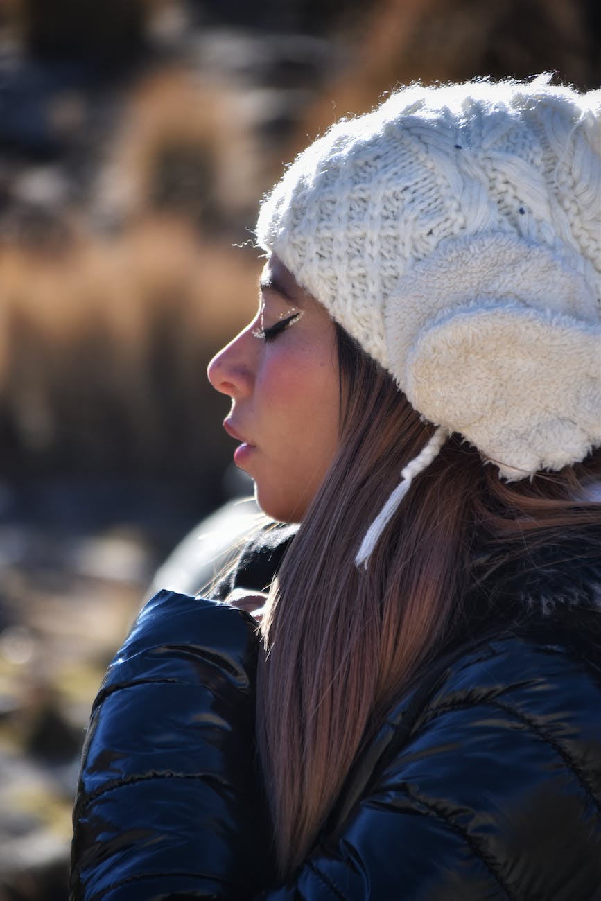 a woman wearing a white hat and jacket
