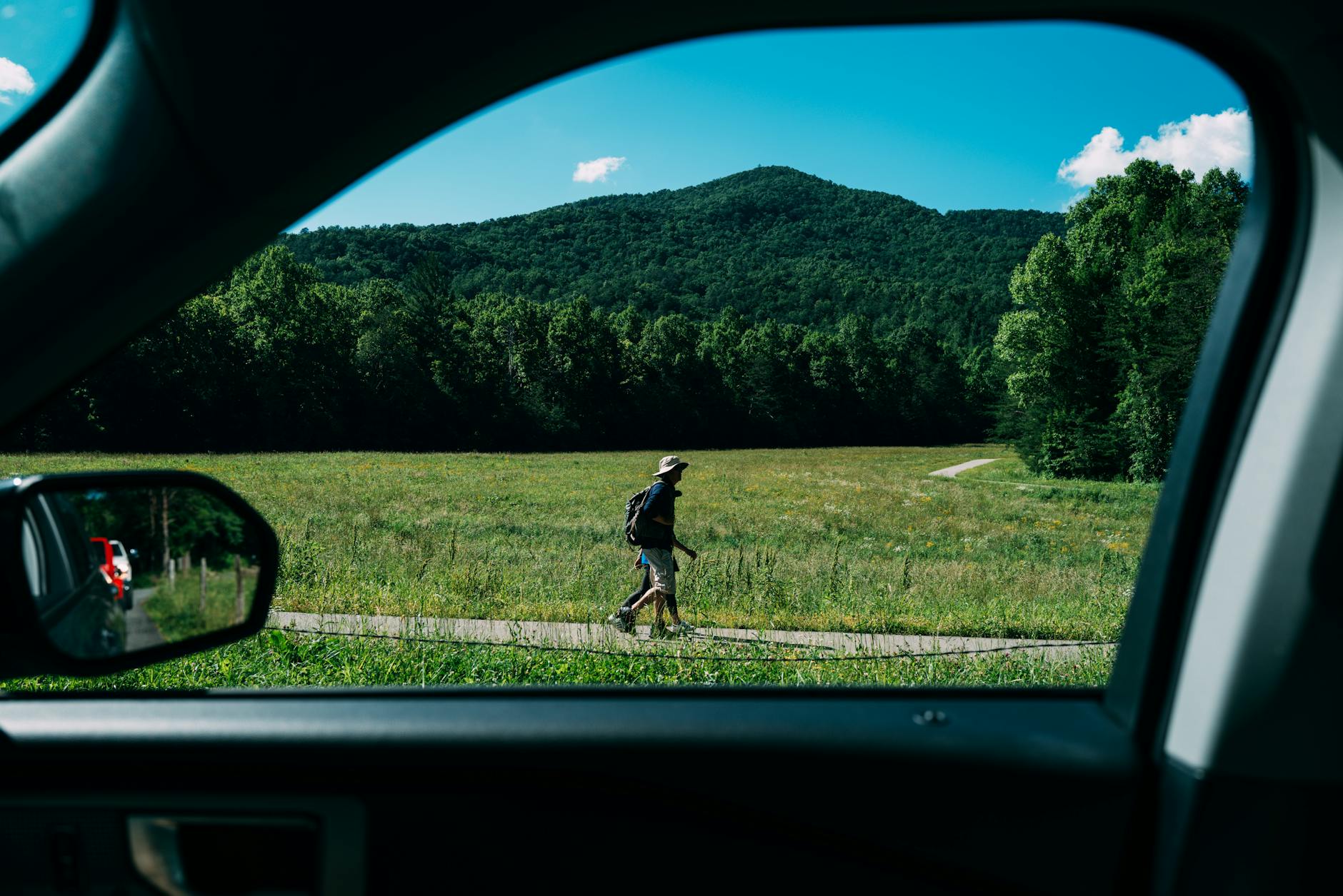man on a trip seen from a car